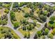 Expansive aerial view of property showcasing mature trees, a circular driveway, and large yard at 4500 S Dasa Dr, Cherry Hills Village, CO 80111