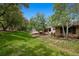 Side view of house with a patio and view of the large backyard at 4500 S Dasa Dr, Cherry Hills Village, CO 80111