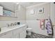 Stylish bathroom featuring patterned floors, subway tile walls, and modern fixtures at 4500 S Dasa Dr, Cherry Hills Village, CO 80111
