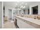 Elegant bathroom with dual sinks, marble countertops, and modern lighting at 4500 S Dasa Dr, Cherry Hills Village, CO 80111