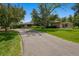 Charming front yard with mature trees and long driveway at 4500 S Dasa Dr, Cherry Hills Village, CO 80111