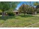 Manicured front yard with mature trees and landscaping at 4500 S Dasa Dr, Cherry Hills Village, CO 80111