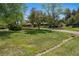 Well-maintained front yard with mature trees and a circular driveway at 4500 S Dasa Dr, Cherry Hills Village, CO 80111