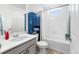 Bright bathroom featuring a modern vanity, toilet, and shower-tub combo offering a functional and relaxing space at 16362 E 111Th Dr, Commerce City, CO 80022