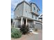 Charming three-story home featuring a covered front porch and attached two-car garage at 16362 E 111Th Dr, Commerce City, CO 80022