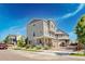Attractive exterior view showcases the three-story home with a well-kept front yard at 16362 E 111Th Dr, Commerce City, CO 80022