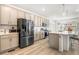 Modern kitchen with stainless steel appliances, ample counter space, and sleek cabinetry at 16362 E 111Th Dr, Commerce City, CO 80022