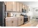 Well-equipped kitchen features stainless steel appliances, a gas range, and plenty of storage at 16362 E 111Th Dr, Commerce City, CO 80022