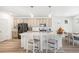 Bright kitchen boasts a large island, stainless steel appliances, and modern lighting at 16362 E 111Th Dr, Commerce City, CO 80022