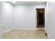 A serene bedroom with wood floors, light blue walls, and an open doorway for a calm and relaxing atmosphere at 3325 Navajo St, Denver, CO 80211