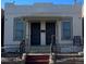 Charming duplex with brick facade, individual entrances, and wrought iron railings at 3325 Navajo St, Denver, CO 80211