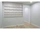 A spacious living room with built-in shelving, wood floors, and ample space for comfortable living and storage at 3325 Navajo St, Denver, CO 80211