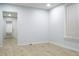 Bright living room featuring wood floors and a window with blinds, offering a clean and inviting space at 3325 Navajo St, Denver, CO 80211