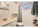 Practical bathroom features a shower over bath, vanity sink and a large mirror at 6431 W 77Th Pl, Arvada, CO 80003