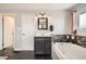 This bathroom features a sink, large tub, and beautifully tiled shower at 6431 W 77Th Pl, Arvada, CO 80003