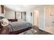 This bedroom boasts hardwood floors, natural light, and access to both a closet and a bathroom at 6431 W 77Th Pl, Arvada, CO 80003