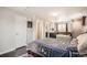 This bedroom features easy access to its bathroom with a tub and tiled shower at 6431 W 77Th Pl, Arvada, CO 80003