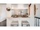 Stylish breakfast bar adjacent to the living room, perfect for entertaining guests at 6431 W 77Th Pl, Arvada, CO 80003