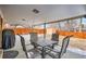 Outdoor living space with a metal table and chairs plus backyard access at 6431 W 77Th Pl, Arvada, CO 80003