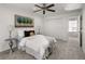 Serene bedroom with plush carpeting, a ceiling fan, and a large closet for ample storage at 9338 W Utah Pl, Lakewood, CO 80232