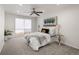 Comfortable bedroom with cozy carpeting, ceiling fan, and tranquil decor at 9338 W Utah Pl, Lakewood, CO 80232