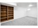 Neutral bedroom with carpet and built-in bookshelves at 9338 W Utah Pl, Lakewood, CO 80232