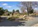 Walkway in a serene community garden with beautiful landscaping at 9338 W Utah Pl, Lakewood, CO 80232