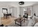 Inviting living room featuring an open floor plan, hardwood floors, and access to an outdoor patio at 9338 W Utah Pl, Lakewood, CO 80232