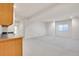 Finished basement with a small kitchenette and lots of open living space at 14032 E Chenango Dr, Aurora, CO 80015