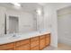 Bright bathroom with double vanity sinks and a separate tub at 14032 E Chenango Dr, Aurora, CO 80015