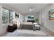 Bedroom features an ensuite bathroom, fan, natural lighting, and modern design at 14032 E Chenango Dr, Aurora, CO 80015