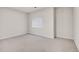 Cozy bedroom with neutral carpet and a bright window at 14032 E Chenango Dr, Aurora, CO 80015