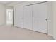 Bedroom with three large closets with white doors at 14032 E Chenango Dr, Aurora, CO 80015
