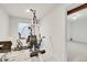Workout room with exercise machine and open doorway at 14032 E Chenango Dr, Aurora, CO 80015