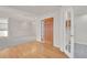 The front foyer features hardwood floors, an ornate door, and sight lines to the formal living room at 14032 E Chenango Dr, Aurora, CO 80015