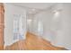 Bright hallway features hardwood floors, recessed lighting, and multiple doorways to other rooms at 14032 E Chenango Dr, Aurora, CO 80015