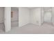Hallway with neutral walls and white trim, offering access to other rooms at 14032 E Chenango Dr, Aurora, CO 80015