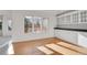 Cozy kitchen with backyard view, white cabinetry and stainless appliances at 14032 E Chenango Dr, Aurora, CO 80015