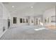 Large open living space featuring fireplace, built in shelving and access to the kitchen at 14032 E Chenango Dr, Aurora, CO 80015