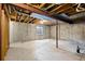 Unfinished basement with concrete walls and floor, offering potential for customization at 10310 E Jewell Ave # 57, Aurora, CO 80247