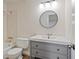 Updated bathroom offers a modern vanity with storage and a shower-tub combo at 10310 E Jewell Ave # 57, Aurora, CO 80247