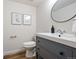 Well-lit bathroom featuring a modern vanity with stylish sink and fixtures at 10310 E Jewell Ave # 57, Aurora, CO 80247