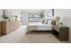 Serene bedroom with neutral tones, plush carpet, and bright natural light at 10310 E Jewell Ave # 57, Aurora, CO 80247