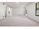 Bright bedroom boasts a large closet, neutral carpet, and a window with natural light at 10310 E Jewell Ave # 57, Aurora, CO 80247