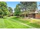 Townhouses with beautiful lawn, mature trees, and well-kept landscaping at 10310 E Jewell Ave # 57, Aurora, CO 80247