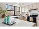 Modern kitchen with quartz countertops, stainless steel appliances and ample natural light at 10310 E Jewell Ave # 57, Aurora, CO 80247