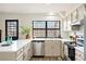 Bright, modern kitchen with quartz countertops and stainless steel appliances at 10310 E Jewell Ave # 57, Aurora, CO 80247