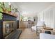 Stylish living room featuring a fireplace, wood floors, and contemporary furnishings at 10310 E Jewell Ave # 57, Aurora, CO 80247