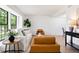 Bright living room with neutral décor, comfortable seating, and abundant natural light at 10310 E Jewell Ave # 57, Aurora, CO 80247