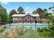 Home exterior showcasing a refreshing pool, complemented by landscaped greenery at 10310 E Jewell Ave # 57, Aurora, CO 80247